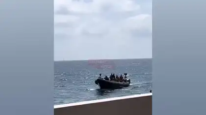Migrant Boat Reaches Spanish Beach Tourists Caught in Sudden Panic Migrant Boat Reaches Spanish Beach Tourists Caught in Sudden Panic