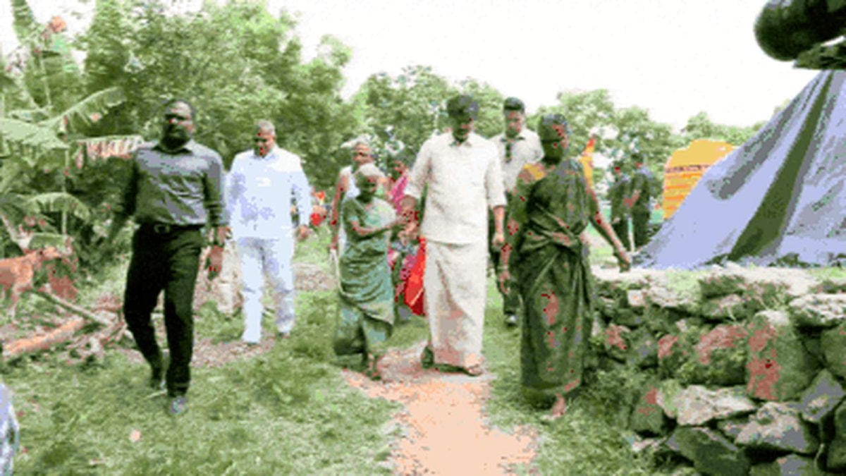 CM Vijay Gifts Sunglasses to Elderly Woman in Mettur CM Vijay Gifts Sunglasses to Elderly Woman in Mettur